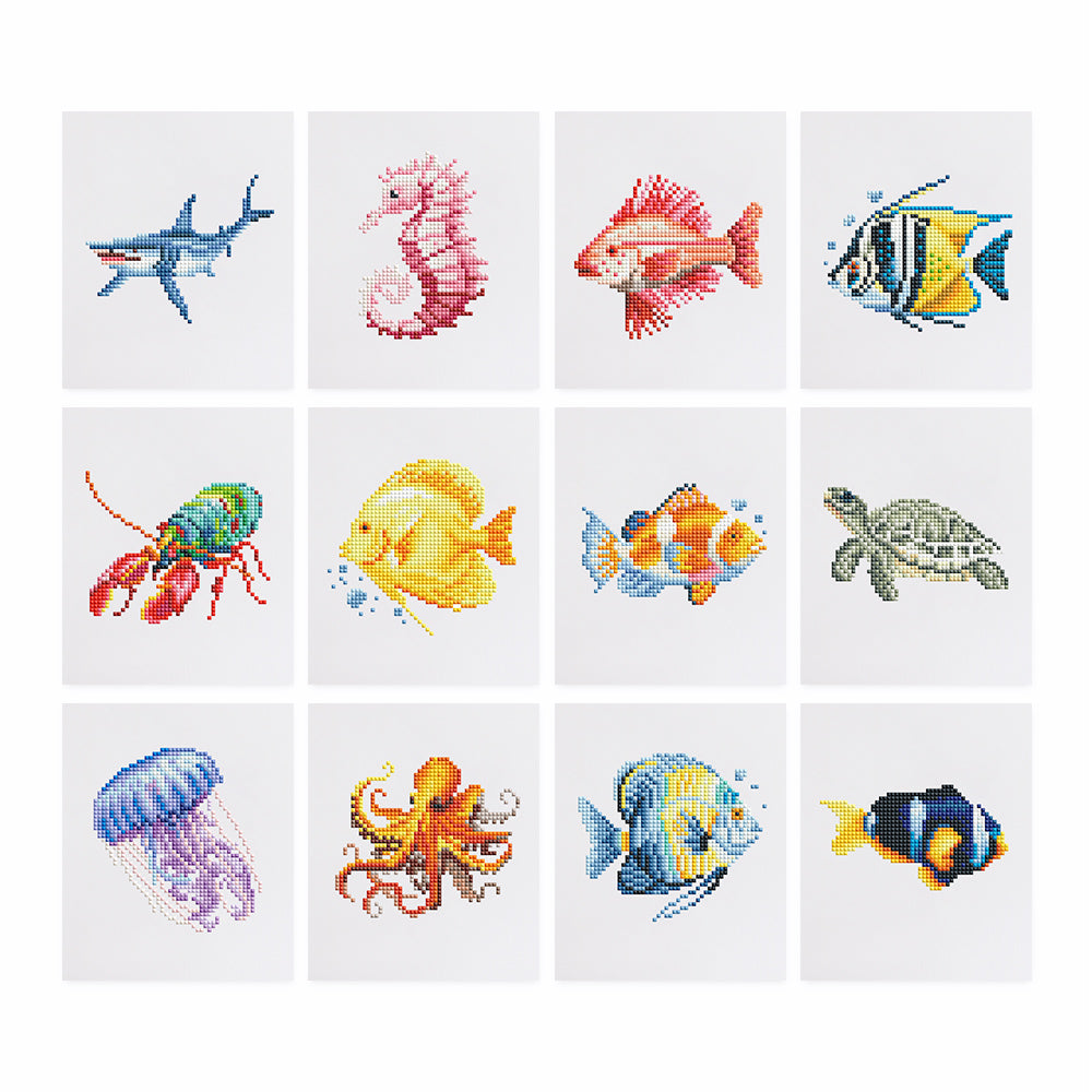 Meeresbewohner 12er SET Diamond Painting featuring mini Kunst designs of various sea creatures including fish, turtle, and jellyfish