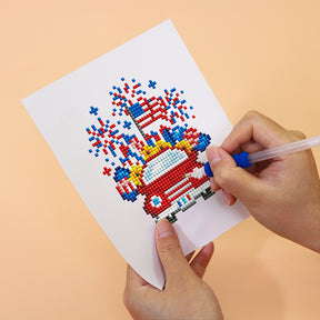 Person completing USA-themed diamond painting of a car with fireworks. Mini Kunst 12er set.