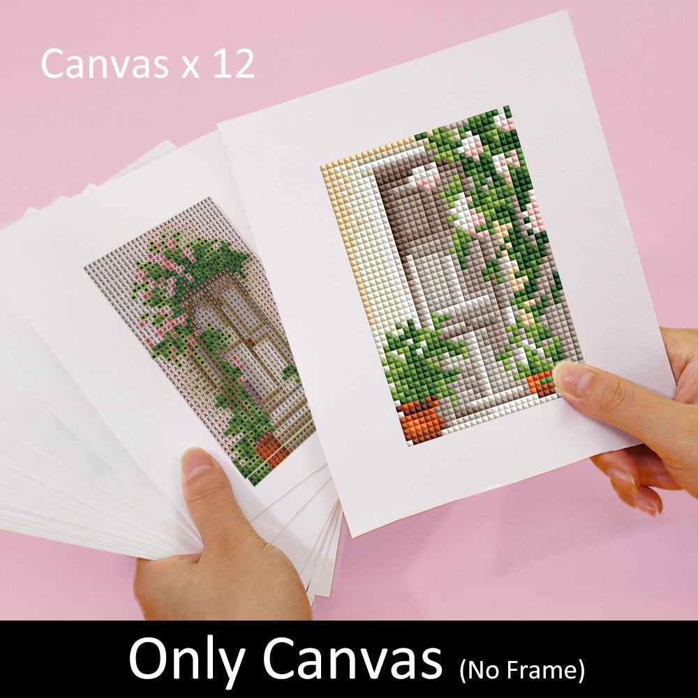 Hands holding mini diamond painting canvases set of 12 with floral designs, titled Willkommen Zwei, without frames.