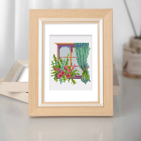 Framed FloraleFenster 12er SET diamond painting with colorful floral design, perfect for mini art enthusiasts.